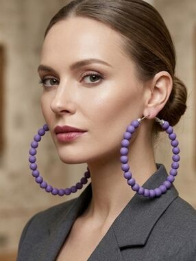 Large hoop earrings featuring wooden beads—super lightweight and substantial in